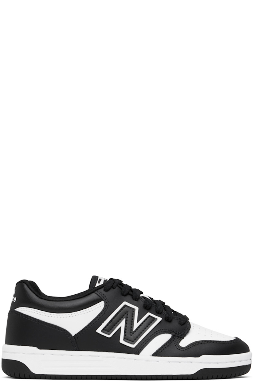 Low-top buffed leather sneakers in black and white.

· Perforations at toe
· Lace-up closure
· Logo patch at padded tongue
· Padded collar
· Logo appliqué at sides
· Logo printed at heel tab
· Mesh lining
· Treaded rubber sole

Supplier color: White/Black