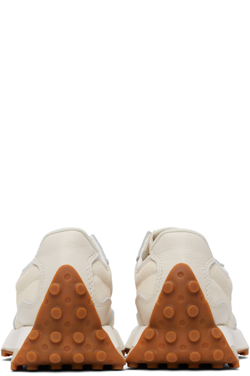 Low-top suede and buffed leather sneakers in off-white.

· Lace-up closure
· Logo patch at padded tongue
· Padded collar
· Buffed leather logo at outer side
· Logo printed at inner side
· Mesh lining
· Foam rubber midsole
· Treaded rubber sole

Supplier color: Linen/Sea salt
