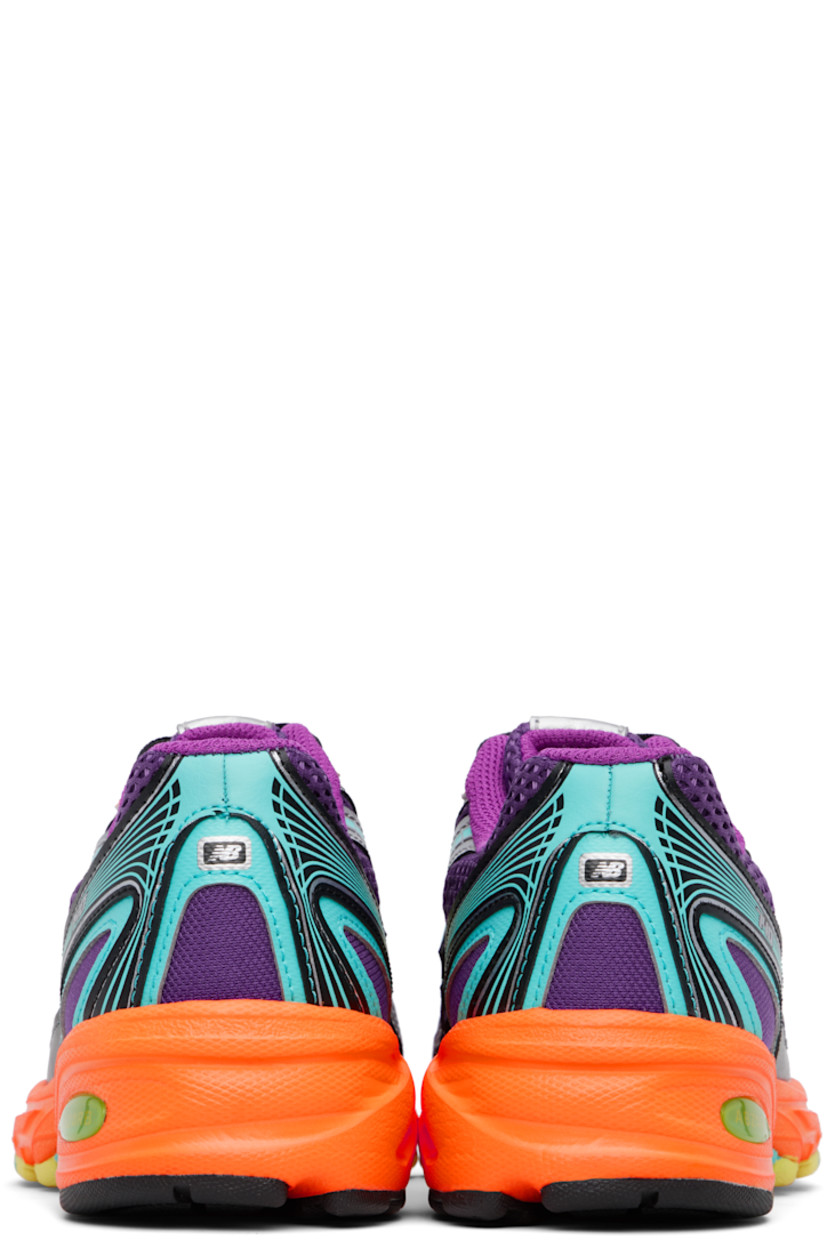 Low-top mesh and grained faux-leather sneakers in purple.

· Reflective trim throughout
· Logo printed at vamp and heel tab
· Lace-up closure
· Logo patch at padded tongue
· Padded collar
· Logo appliqué at sides
· Mesh lining
· ABZORB foam rubber midsole
· Treaded rubber sole

Supplier color: Concord grape/Purple fuchsia/Sun glow
