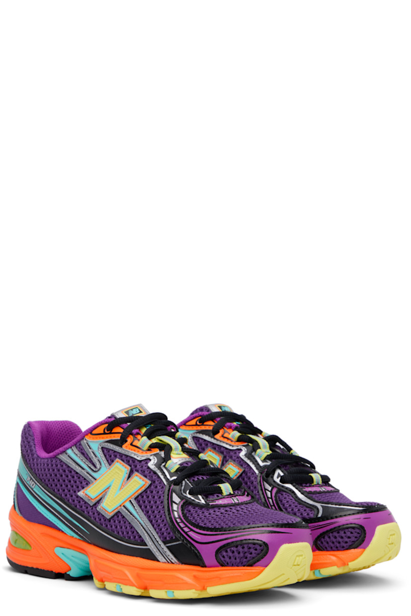 Low-top mesh and grained faux-leather sneakers in purple.

· Reflective trim throughout
· Logo printed at vamp and heel tab
· Lace-up closure
· Logo patch at padded tongue
· Padded collar
· Logo appliqué at sides
· Mesh lining
· ABZORB foam rubber midsole
· Treaded rubber sole

Supplier color: Concord grape/Purple fuchsia/Sun glow