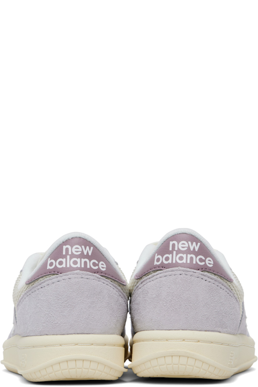 Low-top pigskin suede, nubuck, and mesh sneakers in off-white and purple.

· Lace-up closure
· Logo patch at padded tongue
· Padded collar
· Logo appliqué at sides
· Logo bonded at heel tab
· Jersey lining
· Logo embossed at textured rubber midsole
· Treaded rubber sole

Supplier color: Pearl grey/Linen/Ice wine