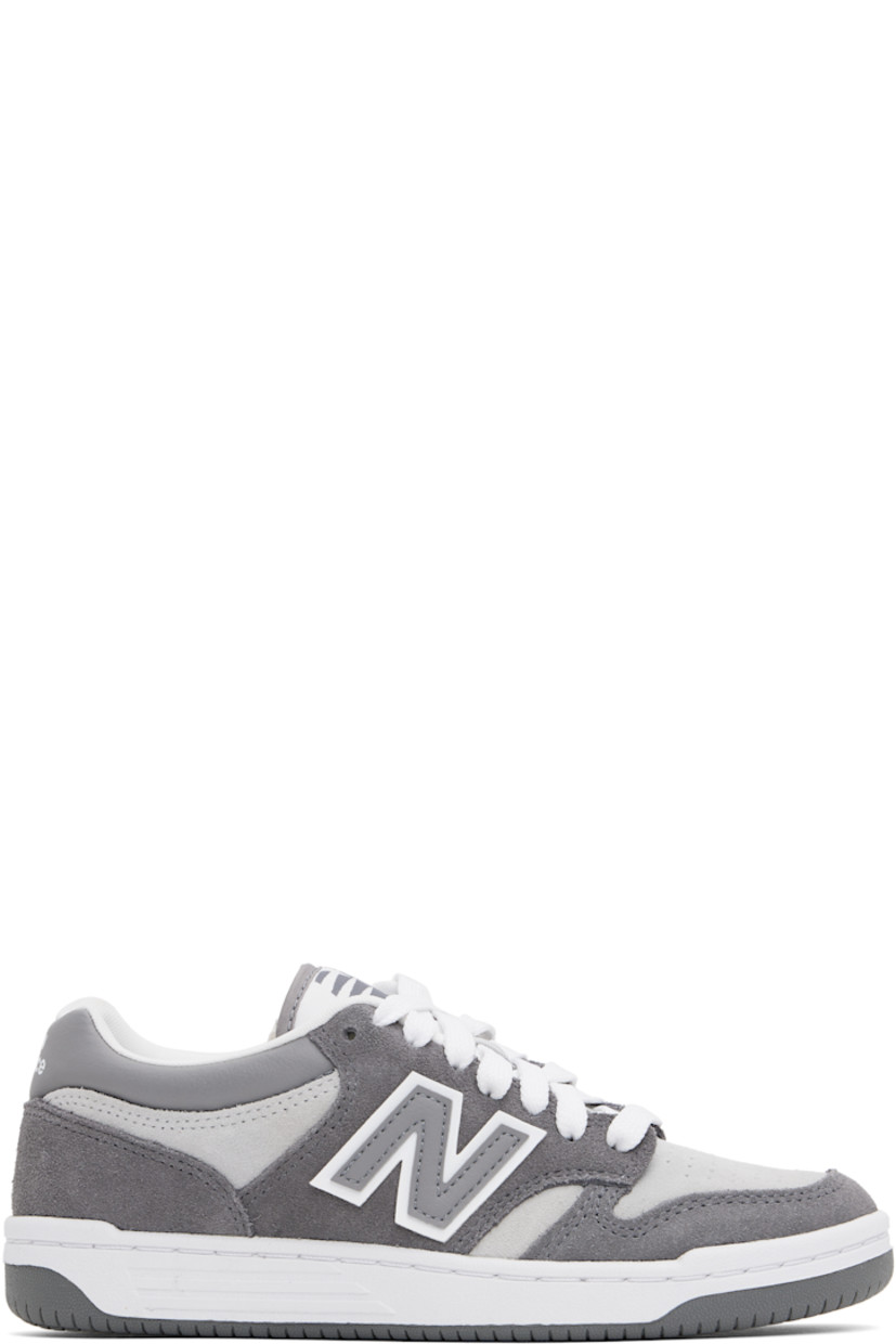 Low-top suede sneakers in gray.

· Perforations at toe
· Lace-up closure
· Logo patch at padded tongue
· Padded collar
· Logo appliqué at sides
· Logo printed at heel tab
· Mesh lining
· Cushioned OrthoLite® footbed
· Treaded rubber sole

Supplier color: Castlerock/Shadow grey/Raincloud