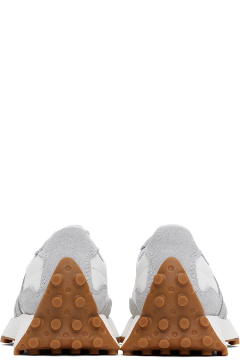 Low-top suede and buffed leather sneakers in white and gray. 

· Lace-up closure
· Logo patch at padded tongue
· Padded collar
· Grained leather logo appliqué at outer side
· Logo embossed at inner side
· Brushed jersey lining
· Foam rubber midsole
· Treaded rubber sole

Supplier color: Raincloud