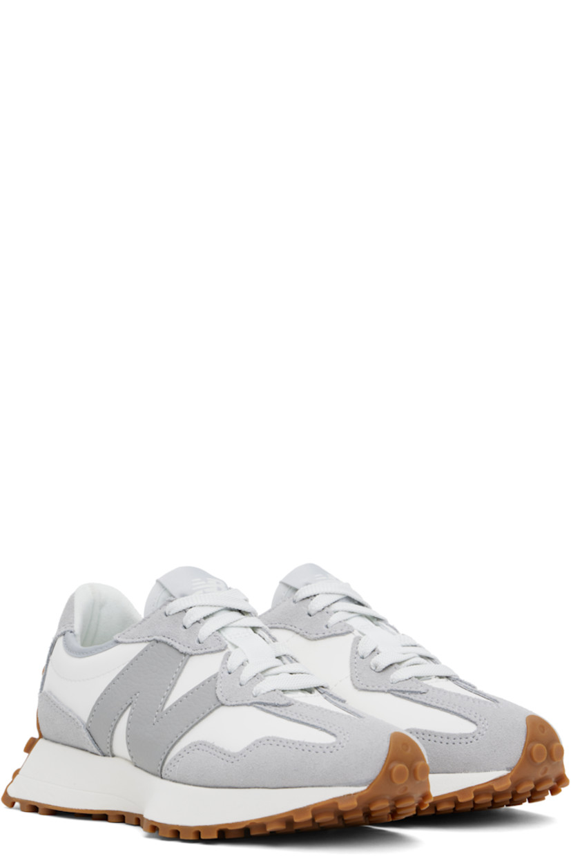 Low-top suede and buffed leather sneakers in white and gray. 

· Lace-up closure
· Logo patch at padded tongue
· Padded collar
· Grained leather logo appliqué at outer side
· Logo embossed at inner side
· Brushed jersey lining
· Foam rubber midsole
· Treaded rubber sole

Supplier color: Raincloud