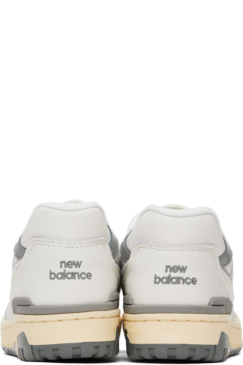 Low-top grained leather sneakers in white and gray.

· Perforations throughout
· Lace-up closure
· Logo patch at padded tongue
· Padded collar
· Logo embroidered at sides and heel counter
· Mesh lining
· Logo embossed at textured rubber midsole
· Treaded rubber sole

Supplier color: Sea salt/Team away grey/Calcium