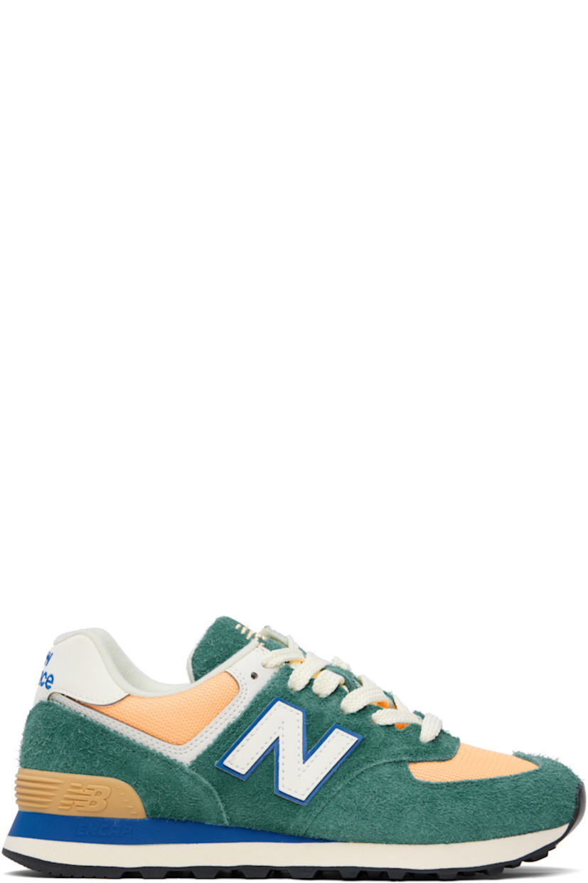 Low-top suede and canvas sneakers in green and orange. 

· Lace-up closure
· Logo embroidered at tongue and heel tab
· Padded tongue and collar
· Logo appliqué at sides
· Logo-embossed rubberized heel stabilizer
· Jersey lining
· ENCAP foam rubber midsole
· Treaded rubber sole

Supplier color: New spruce/Peach blossom/Team royal