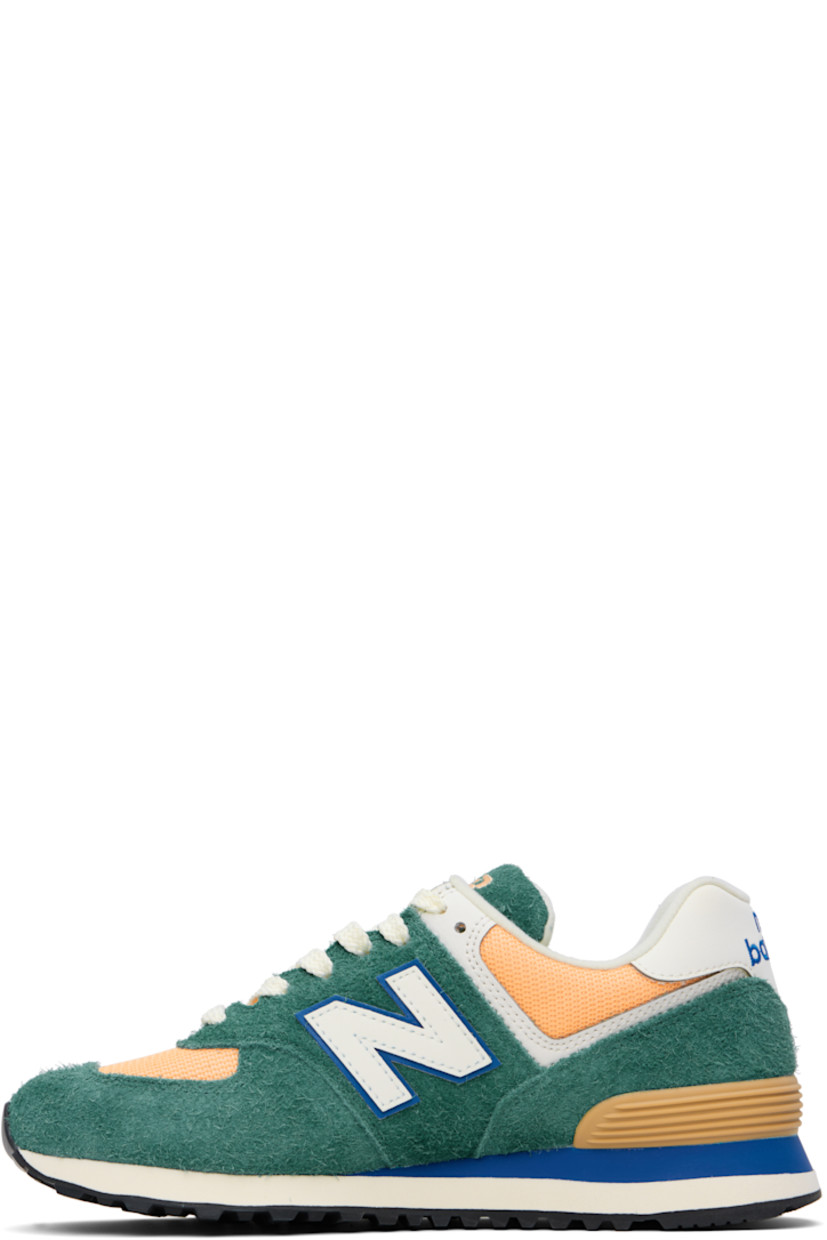 Low-top suede and canvas sneakers in green and orange. 

· Lace-up closure
· Logo embroidered at tongue and heel tab
· Padded tongue and collar
· Logo appliqué at sides
· Logo-embossed rubberized heel stabilizer
· Jersey lining
· ENCAP foam rubber midsole
· Treaded rubber sole

Supplier color: New spruce/Peach blossom/Team royal