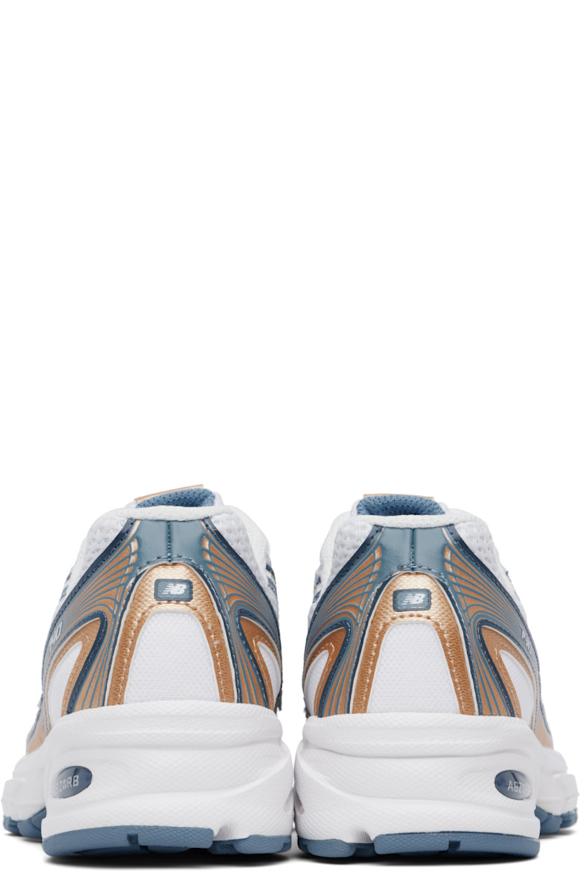 Low-top mesh and grained faux-leather sneakers in white and tan.

· Reflective trim throughout
· Logo printed at vamp and heel tab
· Lace-up closure
· Logo patch at padded tongue
· Padded collar
· Logo appliqué at sides
· Mesh lining
· ABZORB foam rubber midsole
· Treaded rubber sole

Supplier color: Heron blue/Vintage indigo/Gold metallic