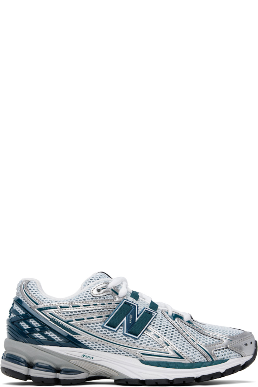 Low-top mesh and grained faux-leather sneakers in green and silver tone.

· Logo embossed at toe 
· Logo printed at vamp
· Lace-up closure
· Logo patch at padded tongue
· Padded collar
· Logo appliqué at sides
· Logo-embossed rubberized heel stabilizer
· ABZORB SBS cushioning at heel
· Mesh lining
· ACTEVA LITE foam rubber midsole
· Treaded N-ergy rubber sole with Stability Web technology

Supplier color: Silver metallic/Deep ocean/White