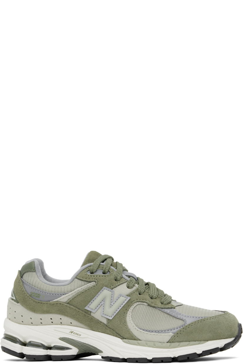 Low-top suede and mesh sneakers in khaki.

· Logo embroidered at vamp
· Lace-up closure
· Inset logo patch at padded tongue
· Padded collar
· Reflective logo appliqué at sides
· Perforated detailing at heel counter
· Jersey lining
· ABZORB® foam rubber midsole
· Treaded N-ergy rubber sole
· Stability Web technology at sole

Supplier color: Dark olivine/Olivine/Slate grey