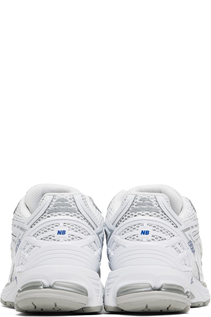 Low-top mesh and grained faux-leather sneakers in white and silver tone.

· Logo printed at vamp
· Lace-up closure
· Logo patch at padded tongue
· Padded collar
· Logo appliqué at sides
· Reflective trim at heel tab
· Logo-embossed rubberized trim at heel counter
· Mesh lining
· ABZORB SBS foam rubber midsole
· ACTEVA LITE unit at foam midsole
· Treaded N-ergy rubber sole
· Stability Web technology at sole

Supplier color: White/Team royal/Silver metallic