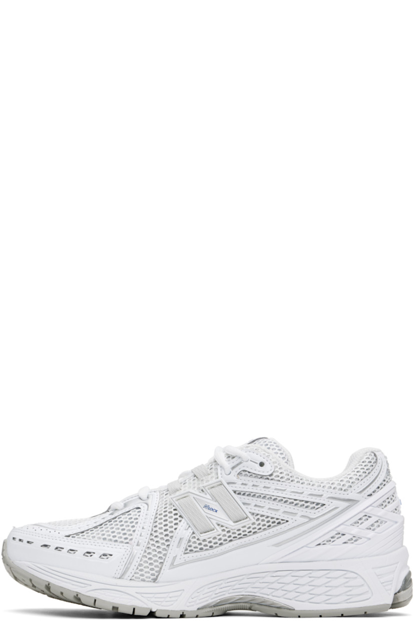 Low-top mesh and grained faux-leather sneakers in white and silver tone.

· Logo printed at vamp
· Lace-up closure
· Logo patch at padded tongue
· Padded collar
· Logo appliqué at sides
· Reflective trim at heel tab
· Logo-embossed rubberized trim at heel counter
· Mesh lining
· ABZORB SBS foam rubber midsole
· ACTEVA LITE unit at foam midsole
· Treaded N-ergy rubber sole
· Stability Web technology at sole

Supplier color: White/Team royal/Silver metallic