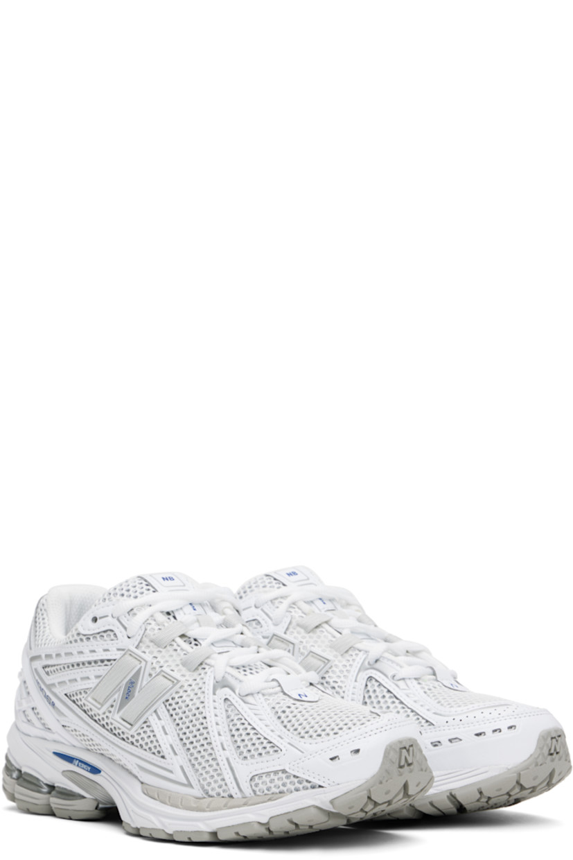 Low-top mesh and grained faux-leather sneakers in white and silver tone.

· Logo printed at vamp
· Lace-up closure
· Logo patch at padded tongue
· Padded collar
· Logo appliqué at sides
· Reflective trim at heel tab
· Logo-embossed rubberized trim at heel counter
· Mesh lining
· ABZORB SBS foam rubber midsole
· ACTEVA LITE unit at foam midsole
· Treaded N-ergy rubber sole
· Stability Web technology at sole

Supplier color: White/Team royal/Silver metallic