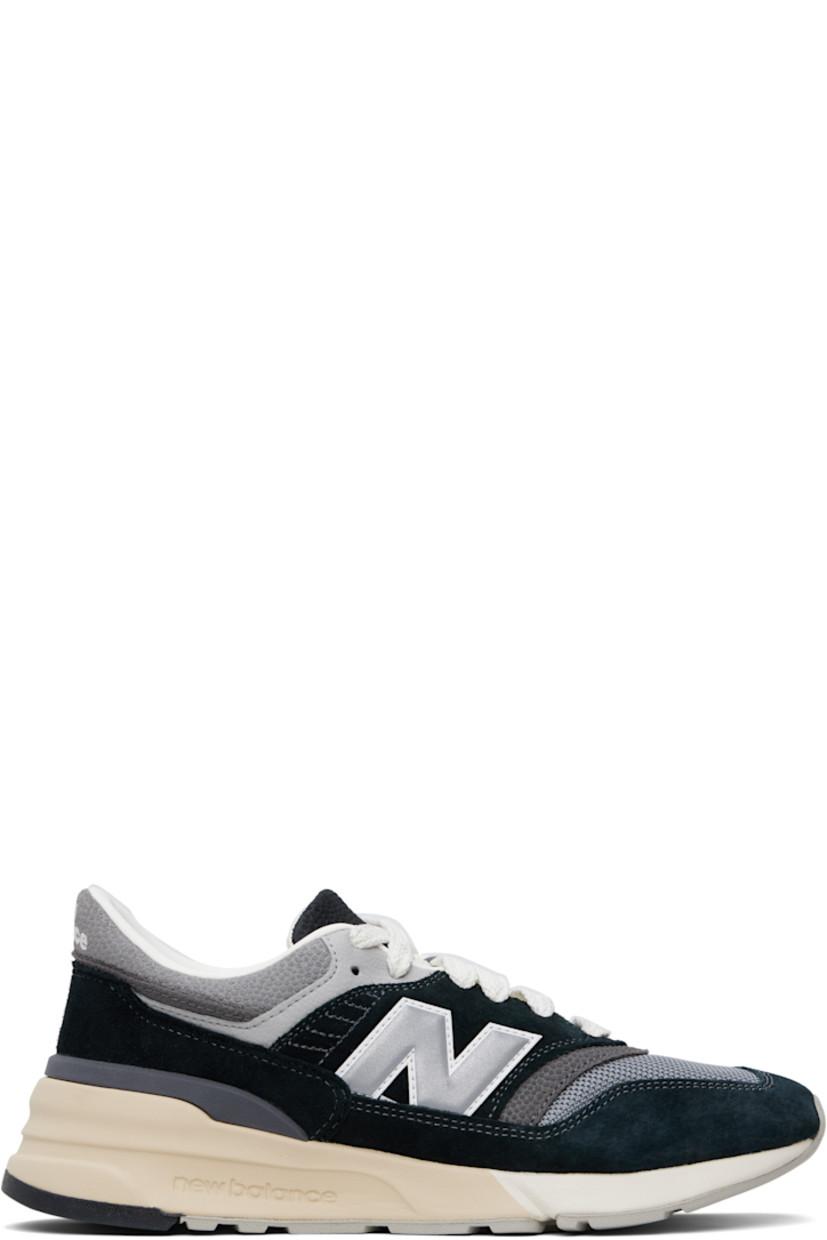 Low-top suede and mesh sneakers in black and gray.

· Lace-up closure
· Logo embroidered at tongue and heel tab
· Padded tongue and collar
· Logo appliqué at sides
· Buffed leather and mesh lining
· Logo embossed at foam rubber midsole
· Treaded rubber sole

Supplier color: Black/Shadow grey