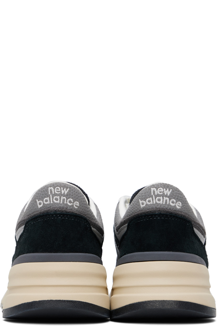 Low-top suede and mesh sneakers in black and gray.

· Lace-up closure
· Logo embroidered at tongue and heel tab
· Padded tongue and collar
· Logo appliqué at sides
· Buffed leather and mesh lining
· Logo embossed at foam rubber midsole
· Treaded rubber sole

Supplier color: Black/Shadow grey