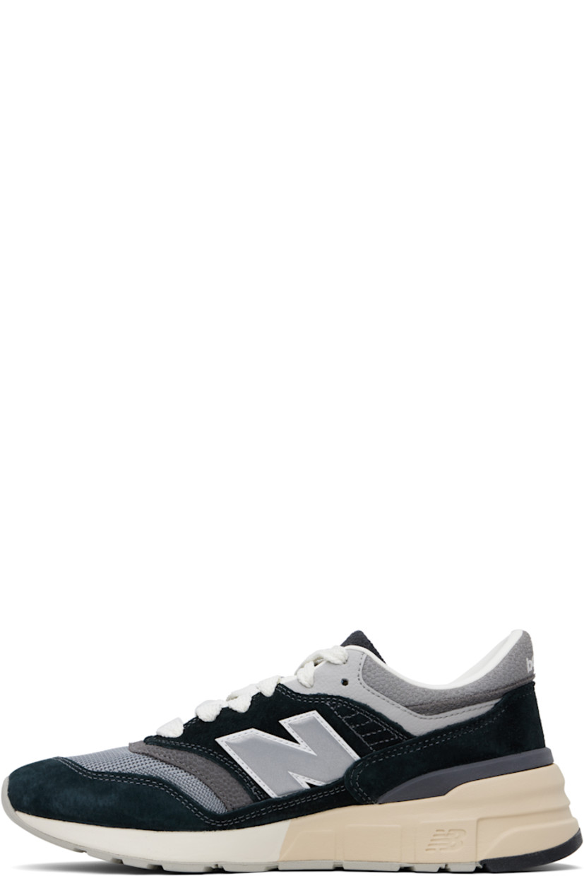 Low-top suede and mesh sneakers in black and gray.

· Lace-up closure
· Logo embroidered at tongue and heel tab
· Padded tongue and collar
· Logo appliqué at sides
· Buffed leather and mesh lining
· Logo embossed at foam rubber midsole
· Treaded rubber sole

Supplier color: Black/Shadow grey