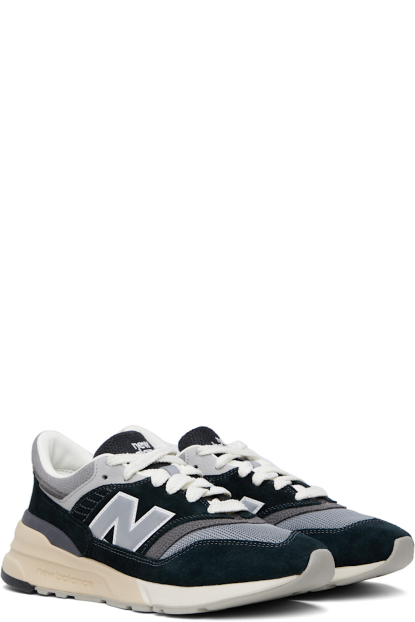 Low-top suede and mesh sneakers in black and gray.

· Lace-up closure
· Logo embroidered at tongue and heel tab
· Padded tongue and collar
· Logo appliqué at sides
· Buffed leather and mesh lining
· Logo embossed at foam rubber midsole
· Treaded rubber sole

Supplier color: Black/Shadow grey