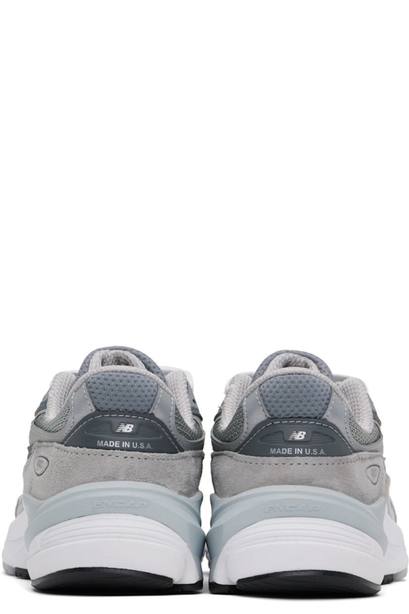 Low-top mesh and pigskin suede sneakers in gray.

· Reflective trim throughout
· Logo printed at vamp
· Lace-up closure
· Logo patch at padded tongue
· Padded collar
· Reflective logo appliqué at sides
· Logo-printed tab at heel counter
· Mesh lining
· ENCAP® and FuelCell foam rubber midsole
· Treaded Ndurance™ rubber sole

Supplier color: Grey