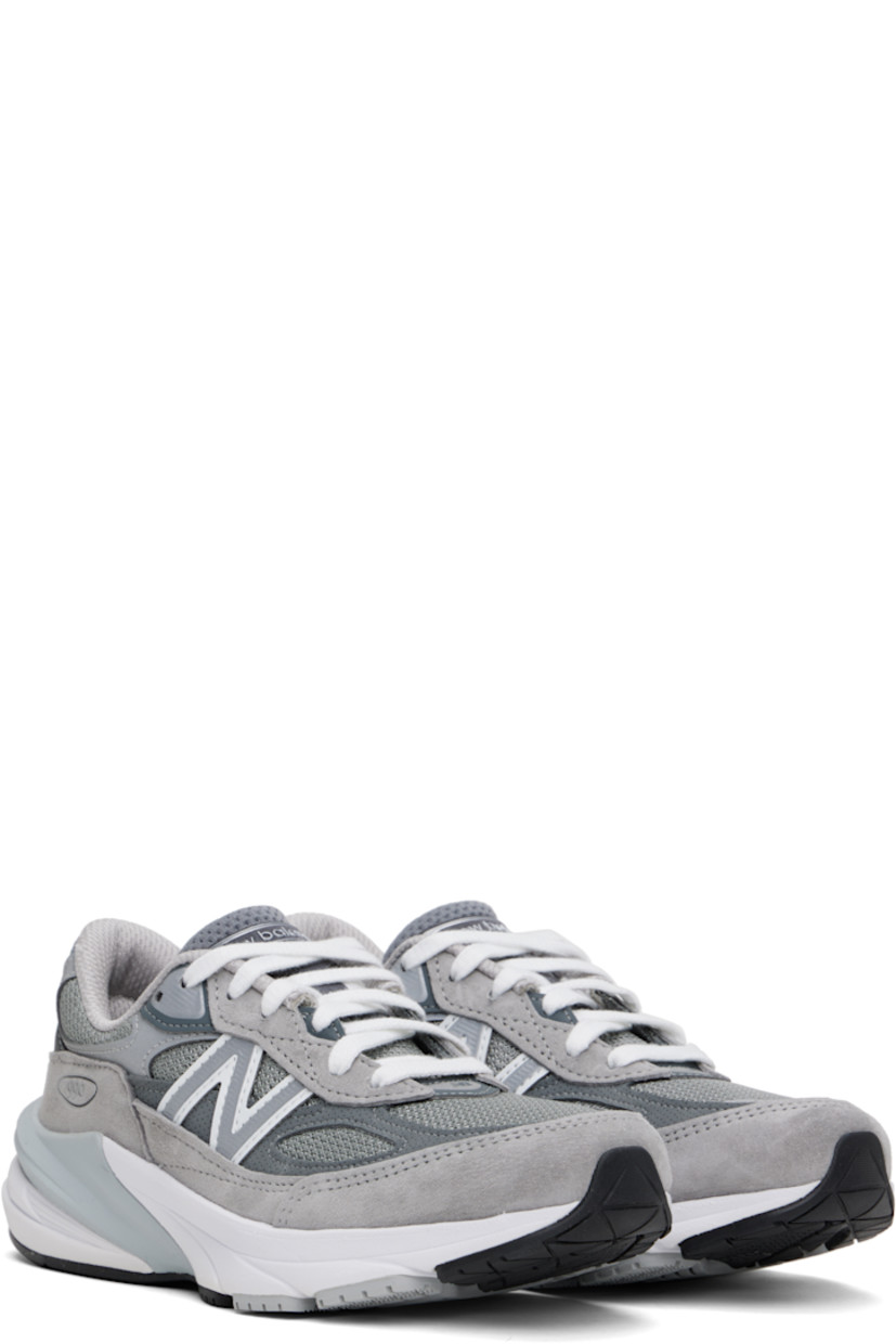 Low-top mesh and pigskin suede sneakers in gray.

· Reflective trim throughout
· Logo printed at vamp
· Lace-up closure
· Logo patch at padded tongue
· Padded collar
· Reflective logo appliqué at sides
· Logo-printed tab at heel counter
· Mesh lining
· ENCAP® and FuelCell foam rubber midsole
· Treaded Ndurance™ rubber sole

Supplier color: Grey