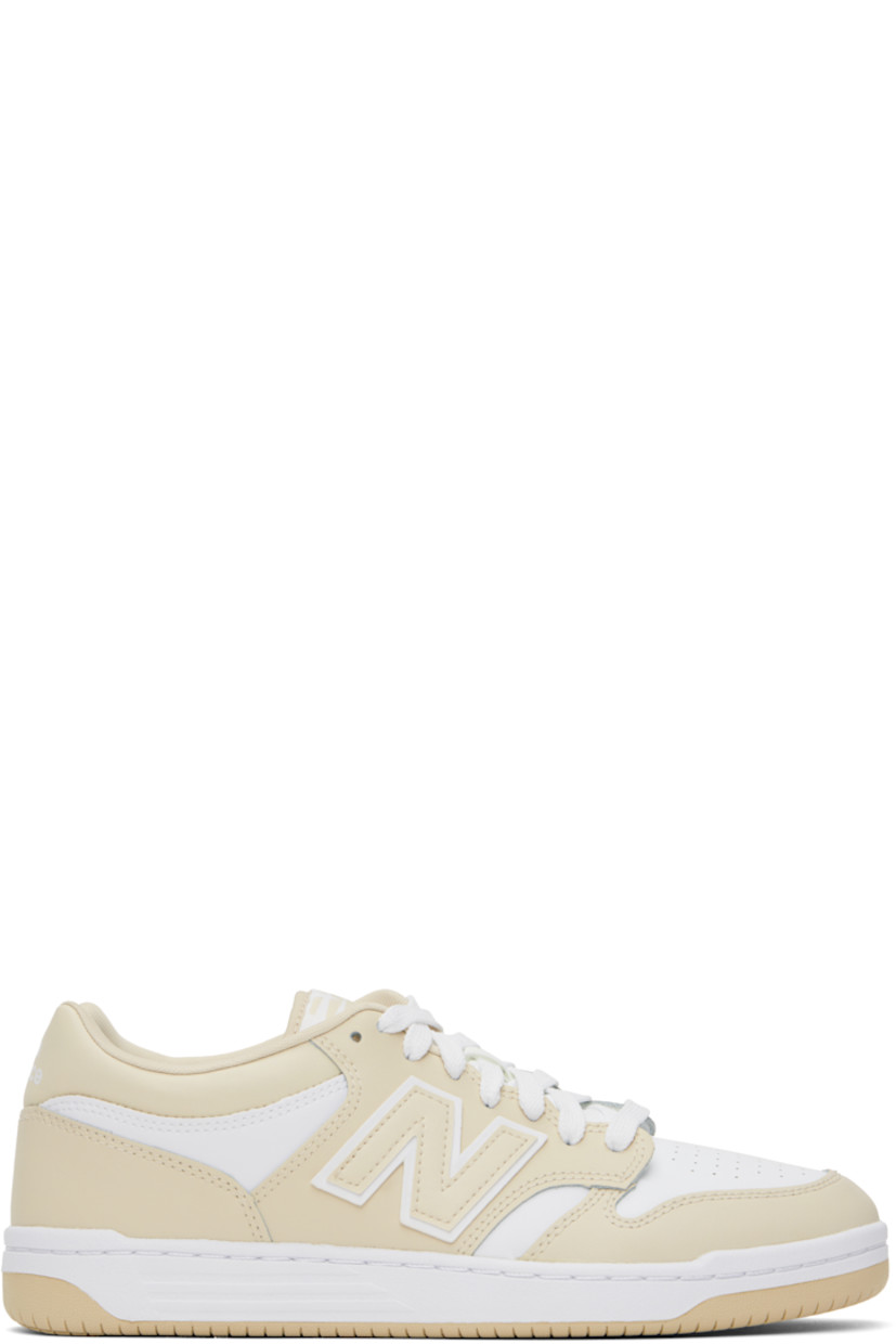 Low-top buffed leather sneakers in white and beige.

· Perforations at toe
· Lace-up closure
· Logo patch at padded tongue
· Padded collar
· Logo appliqué at sides
· Logo printed at heel tab
· Mesh lining
· Treaded rubber sole

Supplier color: Timberwolf