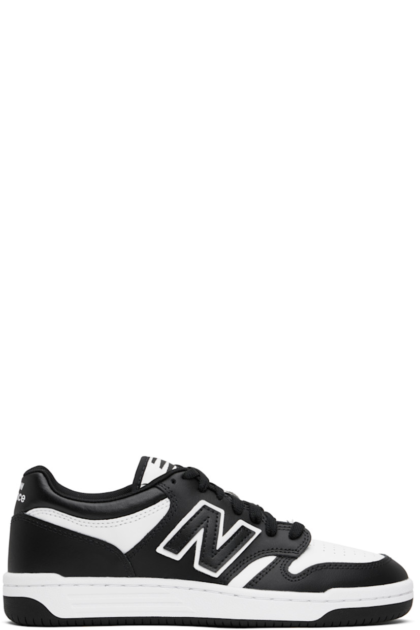 Low-top buffed leather sneakers in black and white.

· Perforated detailing at toe
· Lace-up closure
· Logo patch at padded tongue
· Padded collar
· Logo appliqué at sides
· Logo printed at heel tab
· Mesh lining
· Treaded rubber sole

Supplier color: White