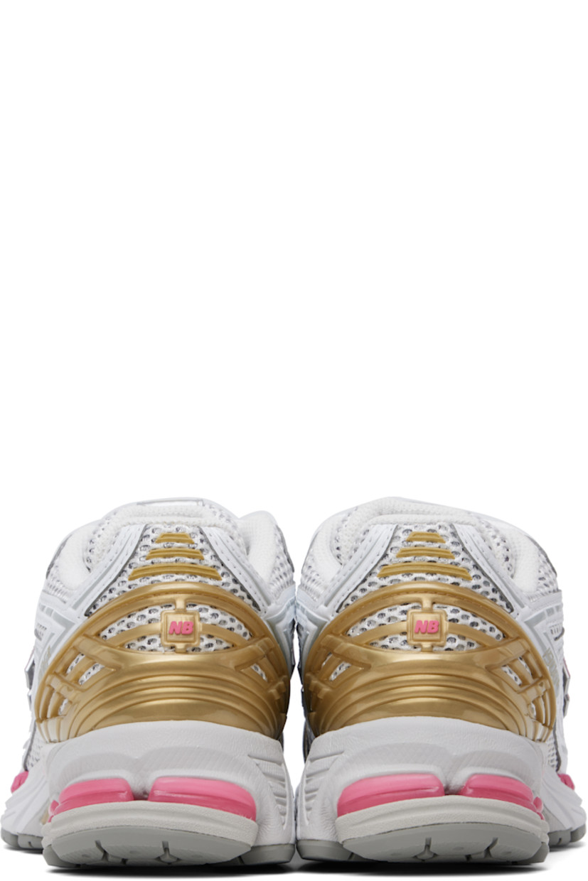 Low-top mesh and grained faux-leather sneakers in silver tone and gold tone.

· Logo embossed at toe 
· Logo printed at vamp
· Lace-up closure
· Logo patch at padded tongue
· Padded collar
· Logo appliqué at sides
· Logo-embossed rubberized heel stabilizer
· ABZORB SBS cushioning at heel
· Mesh lining
· ACTEVA LITE foam rubber midsole
· Treaded N-ergy rubber sole with Stability Web technology

Supplier color: Silver metallic/Dragon berry/White