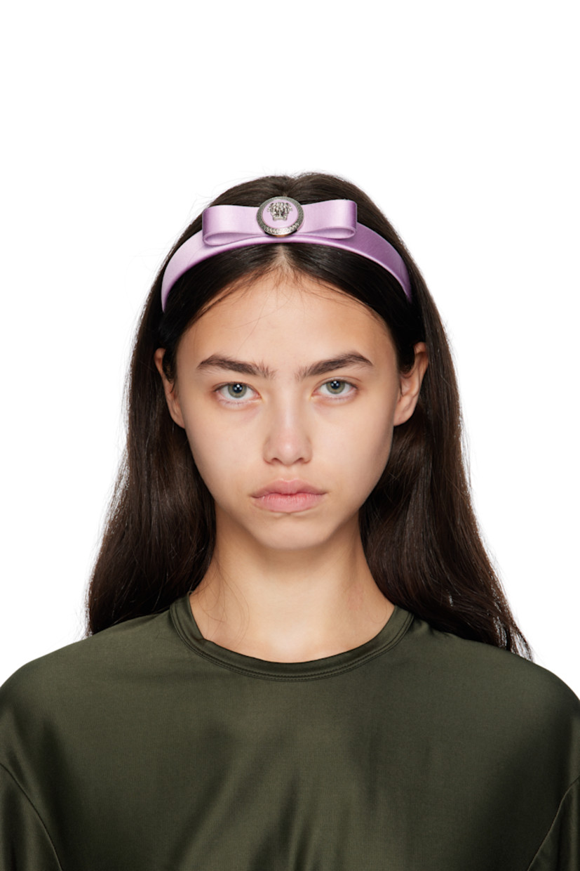 Satin headband. 

· Enameled logo and bow at crown
· Grosgrain lining 
· D5"

Supplier color: Dusty lavender
