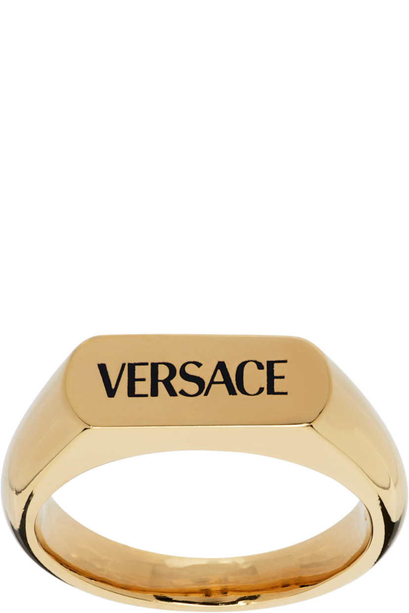 Signet ring in gold tone. Logo engraved at face.

Supplier color: Light gold