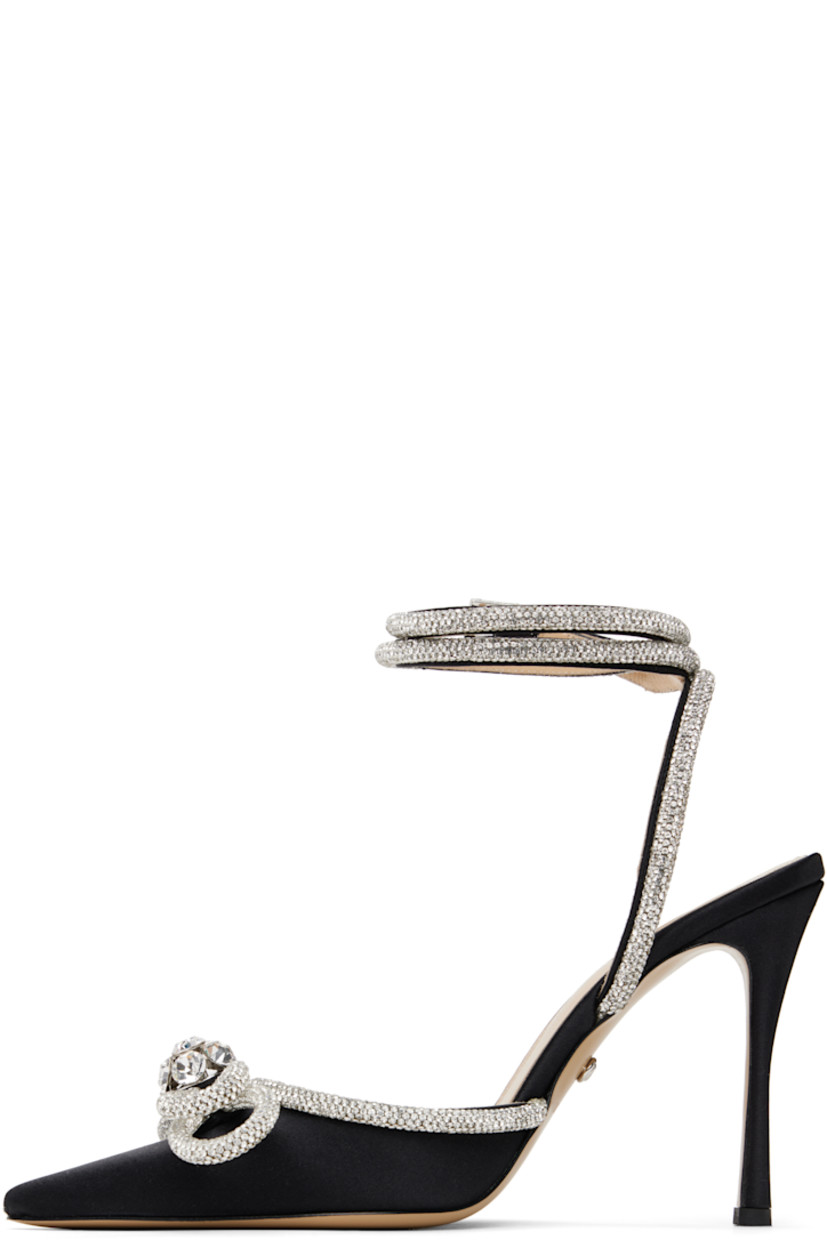 Silk satin heels in black.

· Crystal-cut detailing throughout
· Pointed toe
· Bow accent at vamp
· Wraparound pin-buckle ankle strap
· Logo stamp at padded leather footbed
· Buffed leather lining
· Covered stiletto heel with rubber injection
· Leather sole
· Heel: H4"

Supplier color: Black
