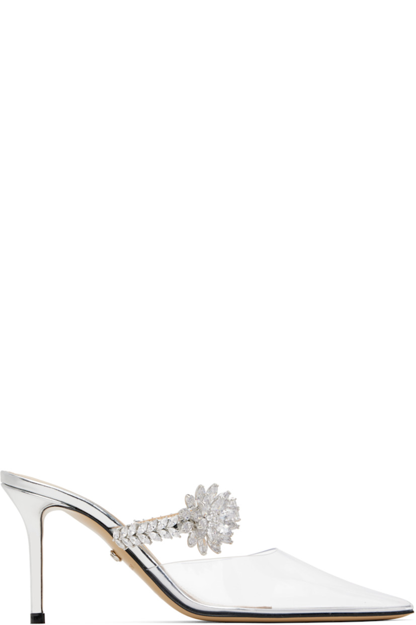 Transparent vinyl and patent leather mules in metallic silver tone. 

· Pointed toe
· Partially elasticized strap at vamp
· Crystal-cut floral detailing at strap 
· Logo stamp at padded footbed
· Buffed leather lining
· Covered stiletto heel with rubber injection
· Leather sole
· Heel: 3.25"

Supplier color: Silver