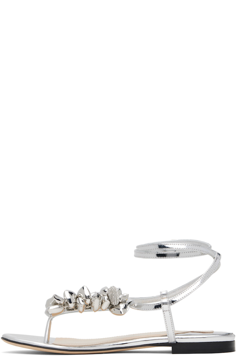 Patent leather flat sandals in silver tone.

· Graphic charms at thong-style strap
· Wraparound pin-buckle ankle strap
· Logo stamp at padded leather footbed
· Stacked leather heel with rubber injection
· Suede sole

Supplier color: Silver