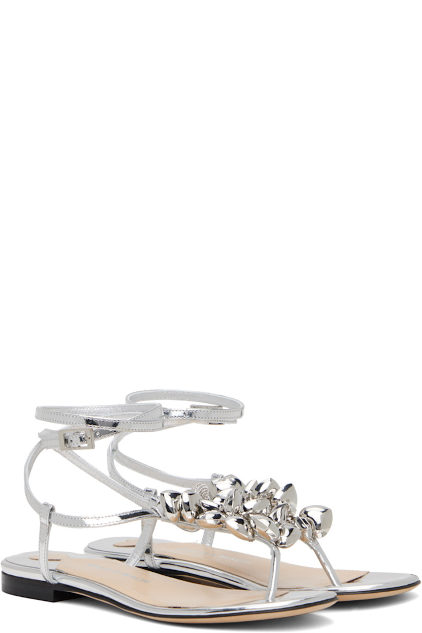 Patent leather flat sandals in silver tone.

· Graphic charms at thong-style strap
· Wraparound pin-buckle ankle strap
· Logo stamp at padded leather footbed
· Stacked leather heel with rubber injection
· Suede sole

Supplier color: Silver
