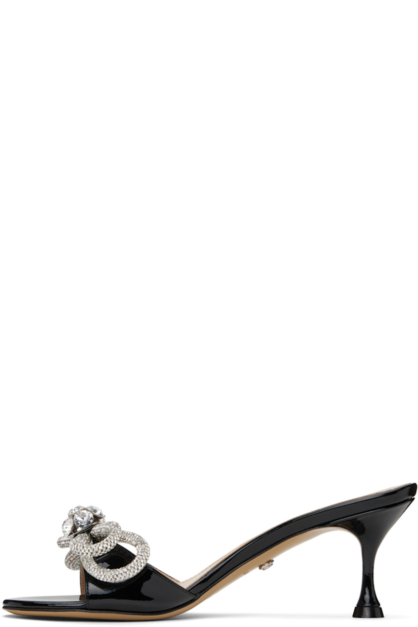 Patent leather heeled sandals in black.

· Open toe
· Bow with crystal-cut accents at vamp
· Logo stamp at padded footbed
· Buffed leather lining
· Covered spool heel with rubber injection
· Leather sole
· Heel: H2"

Supplier color: Black
