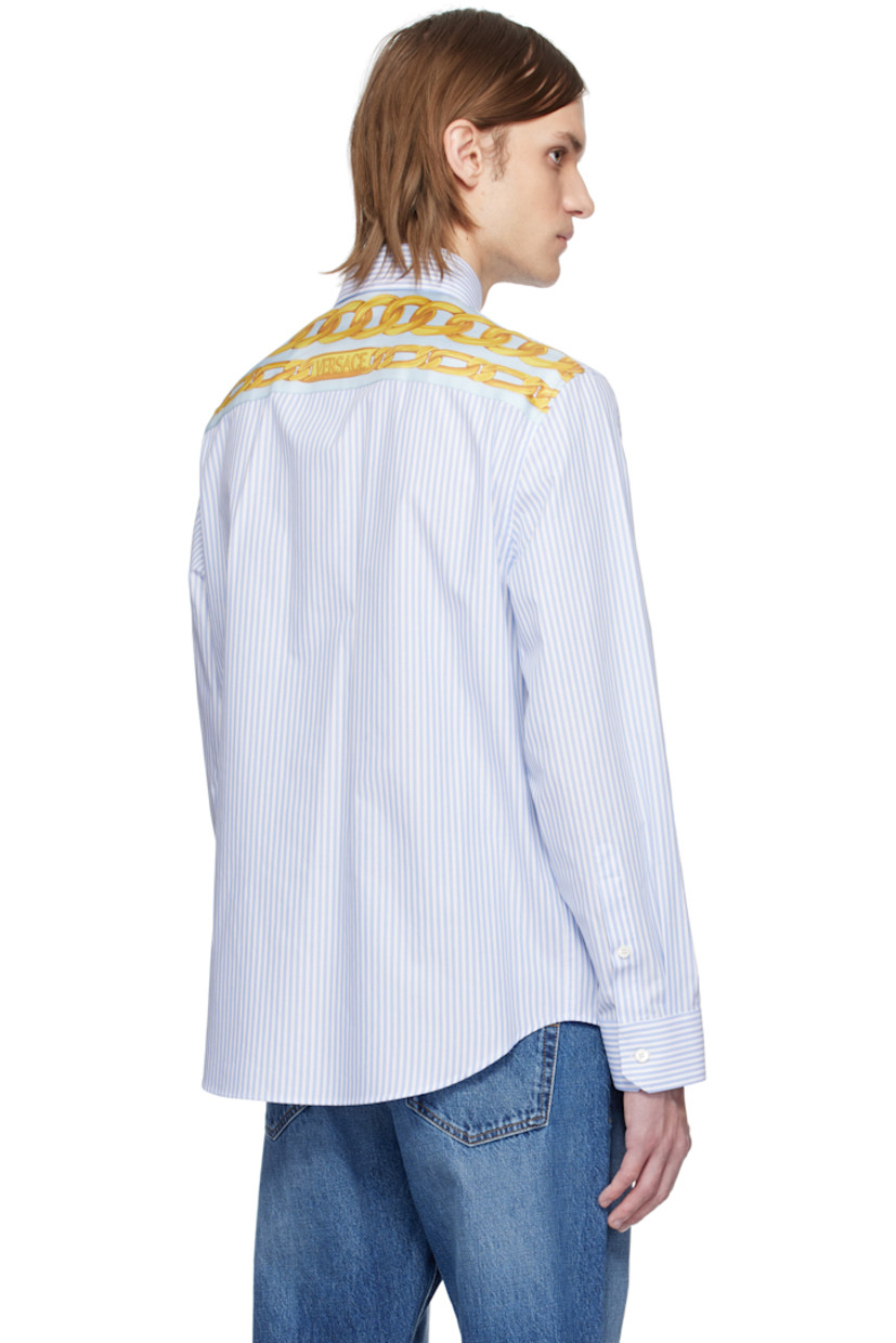 Cotton poplin shirt. Stripe pattern throughout.

· Button-down spread collar
· Button closure
· Logo and text embroidered at patch pocket
· Shirttail hem
· Buttoned barrel cuffs
· Logo graphic printed at silk poplin yoke

Supplier color: Pastel blue