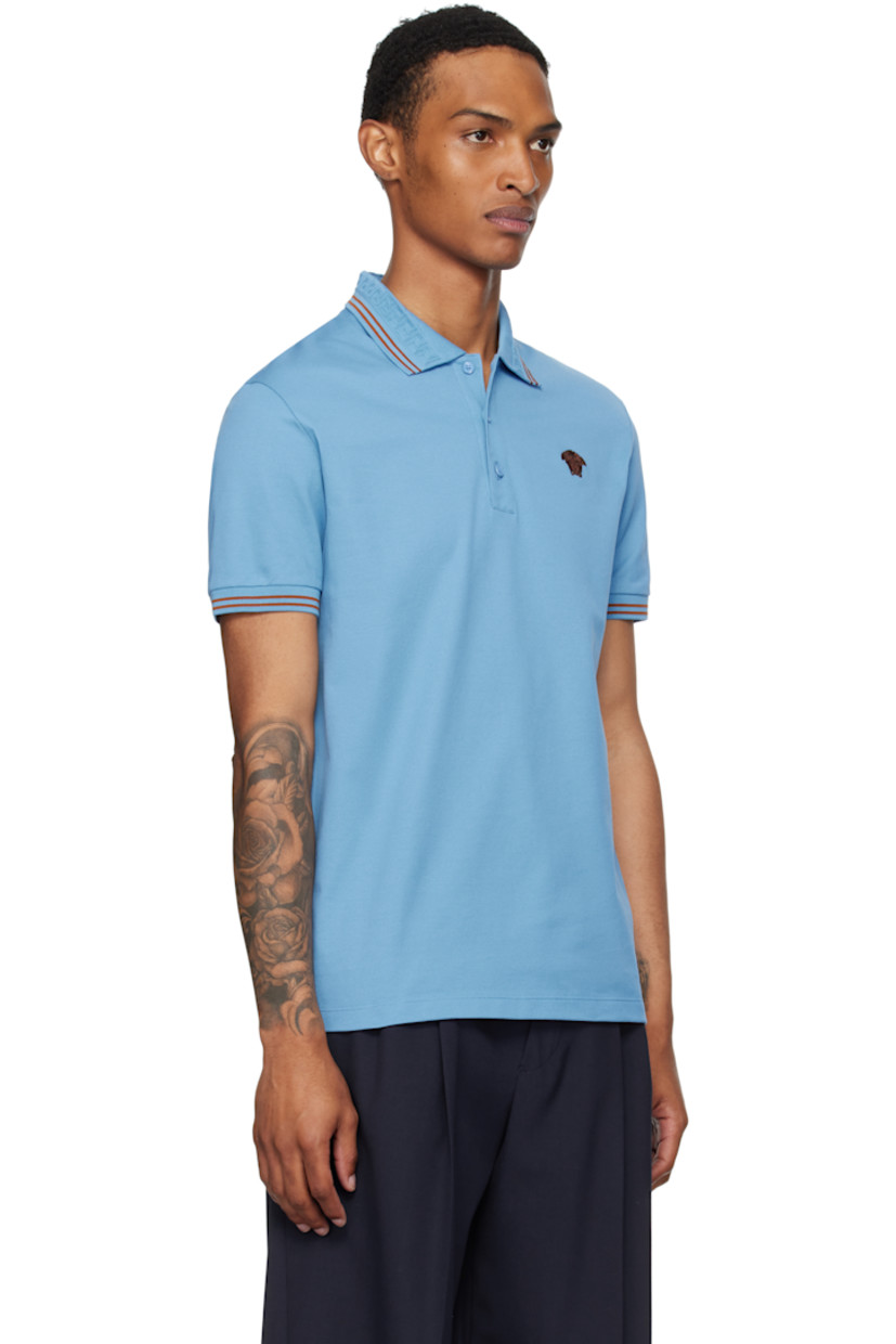 Cotton piqué polo.

· Stripes at rib-knit spread collar and cuffs
· Jacquard Greek key pattern at collar
· Three-button placket
· Embroidered logo at chest

Supplier color: Blue