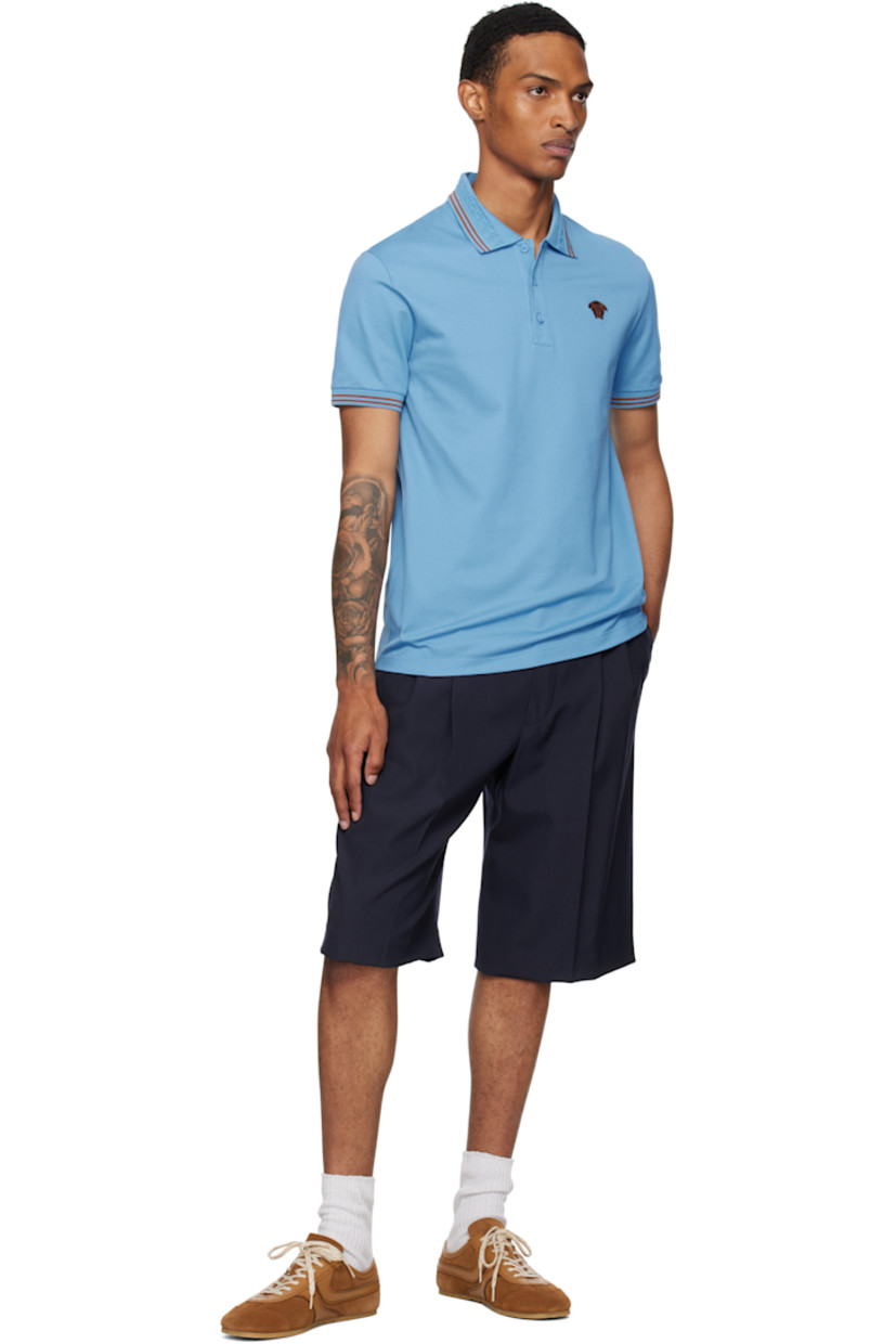 Cotton piqué polo.

· Stripes at rib-knit spread collar and cuffs
· Jacquard Greek key pattern at collar
· Three-button placket
· Embroidered logo at chest

Supplier color: Blue