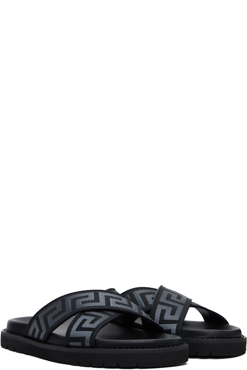 Webbing slip-on sandals in black.

· Open toe
· Jacquard Greek key at crisscrossing vamp straps
· Logo embossed at molded leather footbed
· Buffed leather lining
· Topstitching at welt
· Treaded foam rubber sole

Supplier color: Black/Anthracite