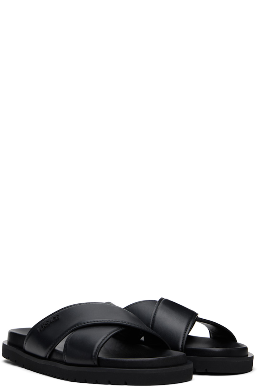 Buffed calfskin slip-on sandals in black.

· Open toe
· Crisscrossing straps at vamp
· Logo hardware at outer side
· Logo embossed at molded leather footbed
· Buffed lambskin lining
· Treaded rubber sole

Supplier color: Black