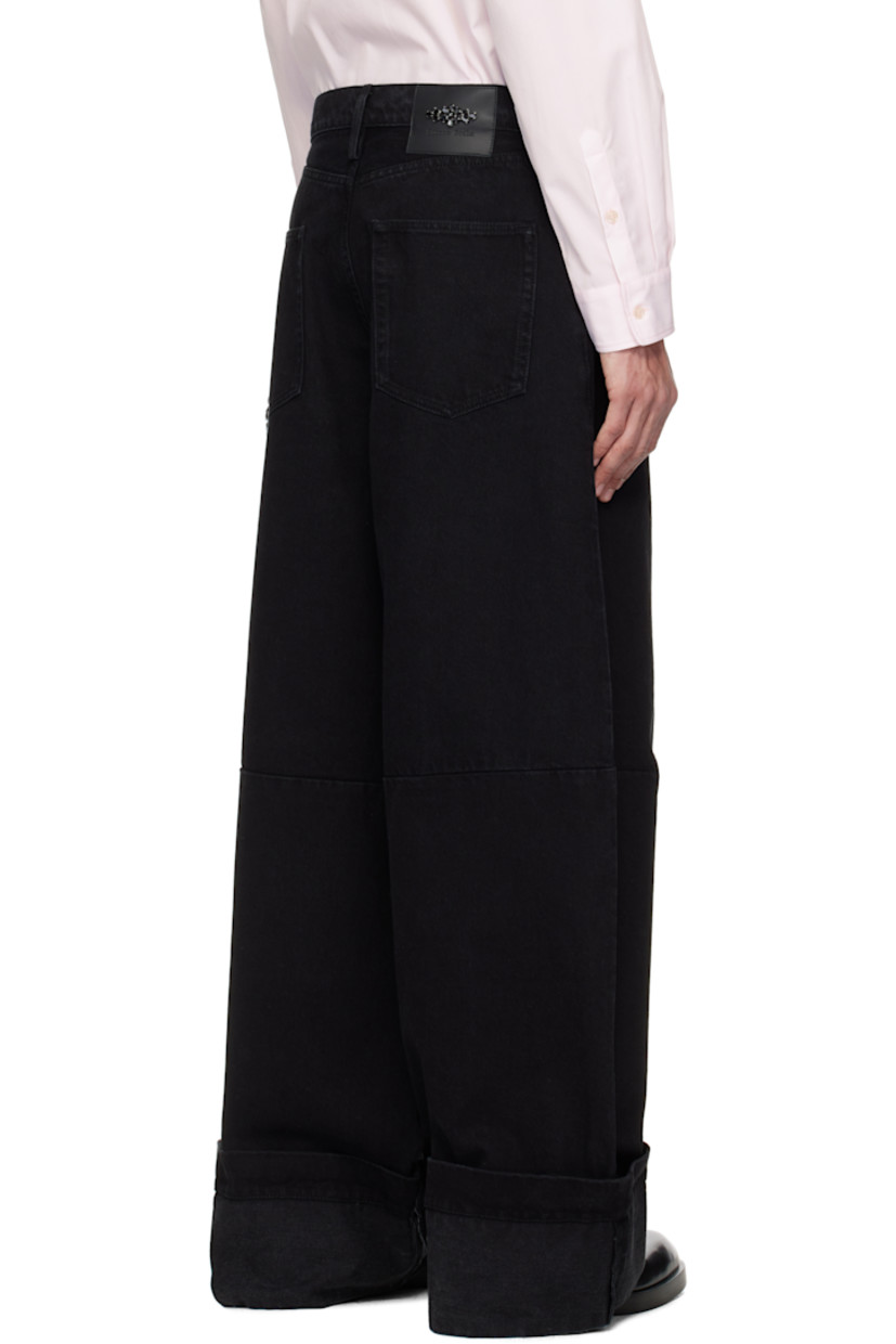Wide-leg non-stretch denim jeans.

· Belt loops
· Five-pocket styling
· Zip fly
· Pleats at front
· Rolled cuffs
· Crystal-cut accents at hammer loop
· Logo patch at back waistband

Supplier color: Black/Jet
