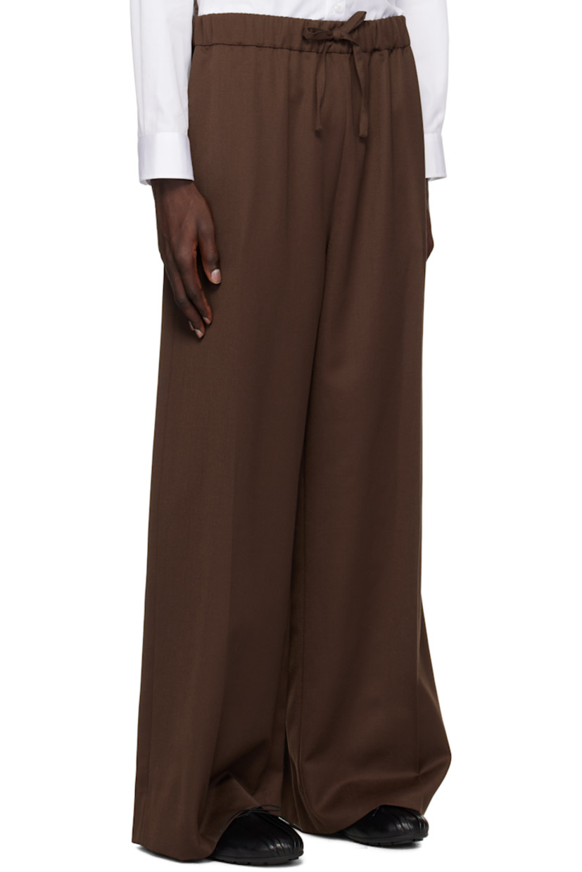 Wide-leg plain-woven polyester- and virgin wool-blend trousers. 

· Drawstring at elasticized waistband
· Four-pocket styling
· Creased legs
· Faux-pearl accent at side seam
· Unlined

Supplier color: Chocolate