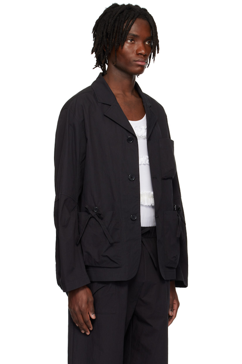 Waxed cotton-blend canvas blazer.

· Notched lapel
· Button closure
· Patch pockets and bow appliqués at front
· Shirttail hem
· Dart at elbows
· Adjustable button fastening at cuffs
· Logo-engraved hardware

Supplier color: Charcoal