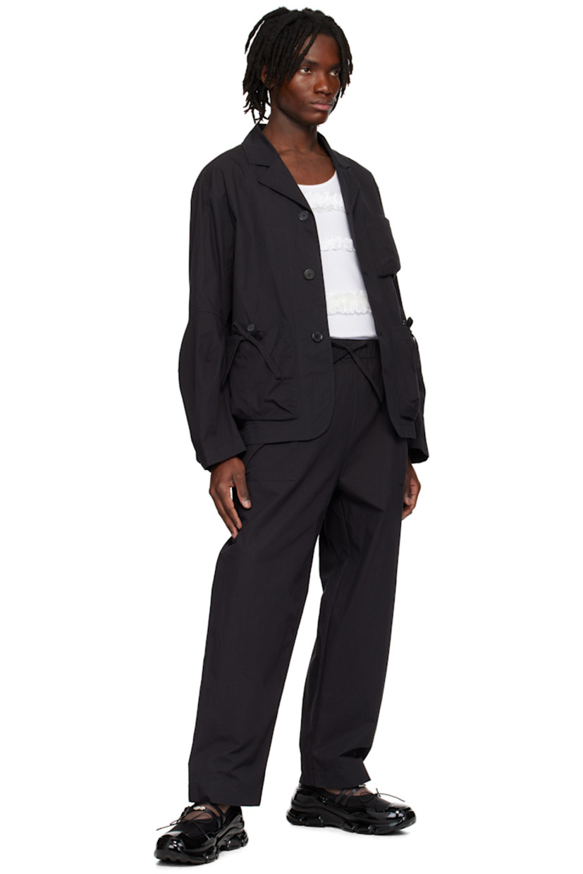 Waxed cotton-blend canvas blazer.

· Notched lapel
· Button closure
· Patch pockets and bow appliqués at front
· Shirttail hem
· Dart at elbows
· Adjustable button fastening at cuffs
· Logo-engraved hardware

Supplier color: Charcoal