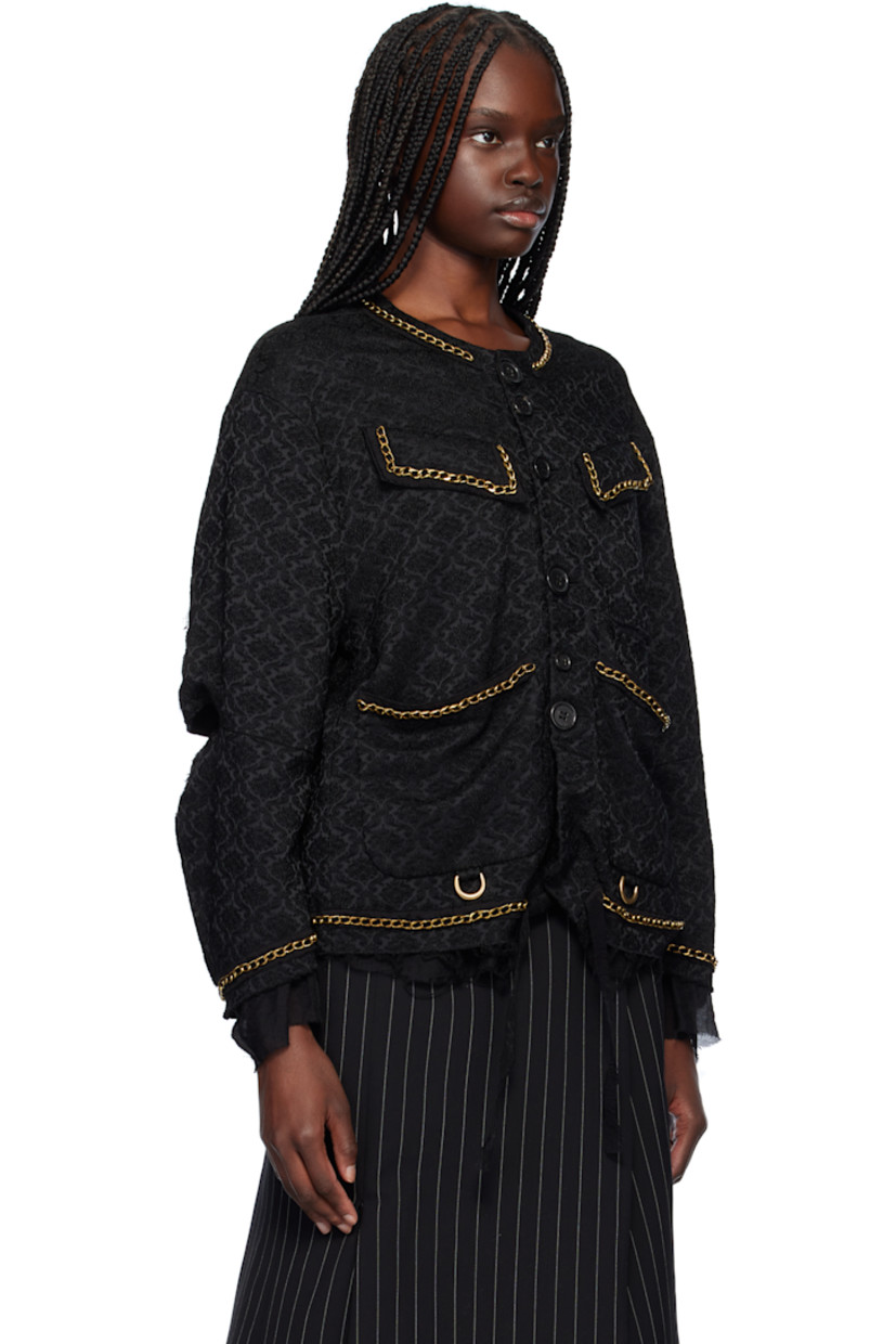 Stretch acrylic-blend brocade jacket. Jacquard graphic pattern and curb chain appliqués throughout.

· Round neck
· Button closure
· Flap and patch pockets
· D-rings at front
· Chiffon trim and frayed edge at hem and cuffs
· Cutout at elbows
· Full chiffon lining

Supplier color: Black base