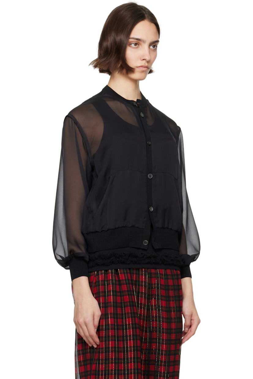 Sheer polyester chiffon cardigan.

· Rib-knit crewneck, hem, and cuffs
· Button closure
· Patch pockets
· Dropped shoulders

Supplier color: Black