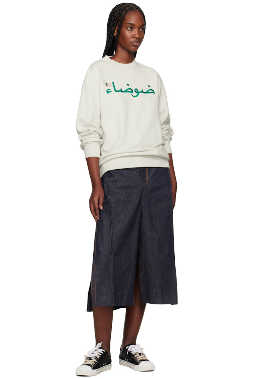 French terry sweatshirt.

· Rib-knit crewneck, hem, and cuffs
· Text embroidered at printed at front
· Beaded floral appliqué at front

Supplier color: Ice gray