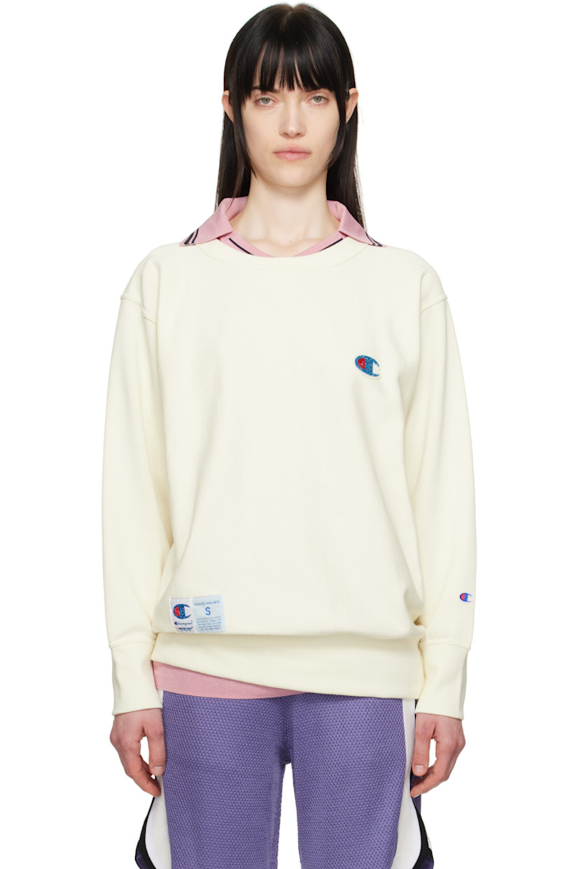 French terry sweatshirt.

· Rib-knit crewneck, hem, and cuffs
· Felted and beaded logo patch at chest
· Logo patch at front hem
· Logo embroidered at cuff
· Dropped shoulder

Part of the UNDERCOVER x Champion collaboration.

Supplier color: Ivory