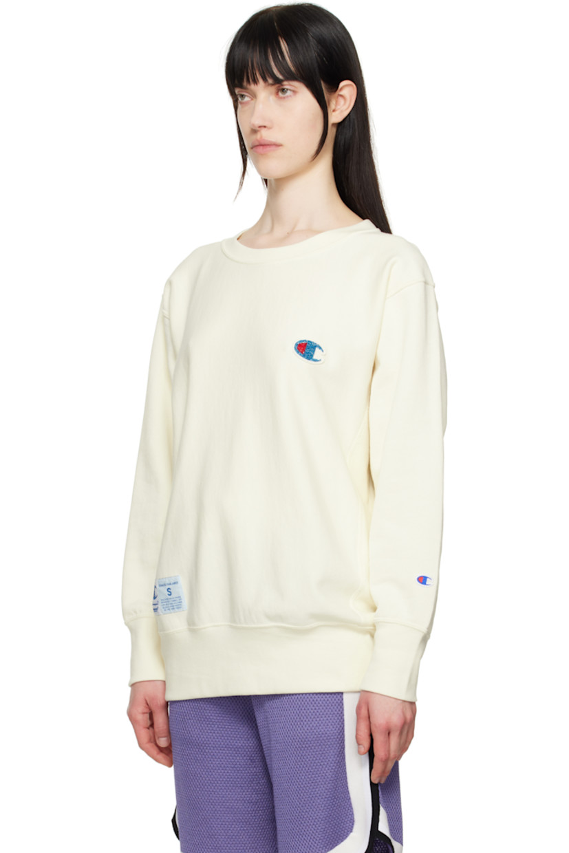 French terry sweatshirt.

· Rib-knit crewneck, hem, and cuffs
· Felted and beaded logo patch at chest
· Logo patch at front hem
· Logo embroidered at cuff
· Dropped shoulder

Part of the UNDERCOVER x Champion collaboration.

Supplier color: Ivory