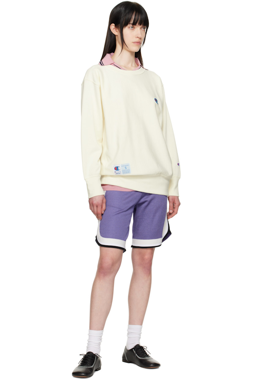 French terry sweatshirt.

· Rib-knit crewneck, hem, and cuffs
· Felted and beaded logo patch at chest
· Logo patch at front hem
· Logo embroidered at cuff
· Dropped shoulder

Part of the UNDERCOVER x Champion collaboration.

Supplier color: Ivory