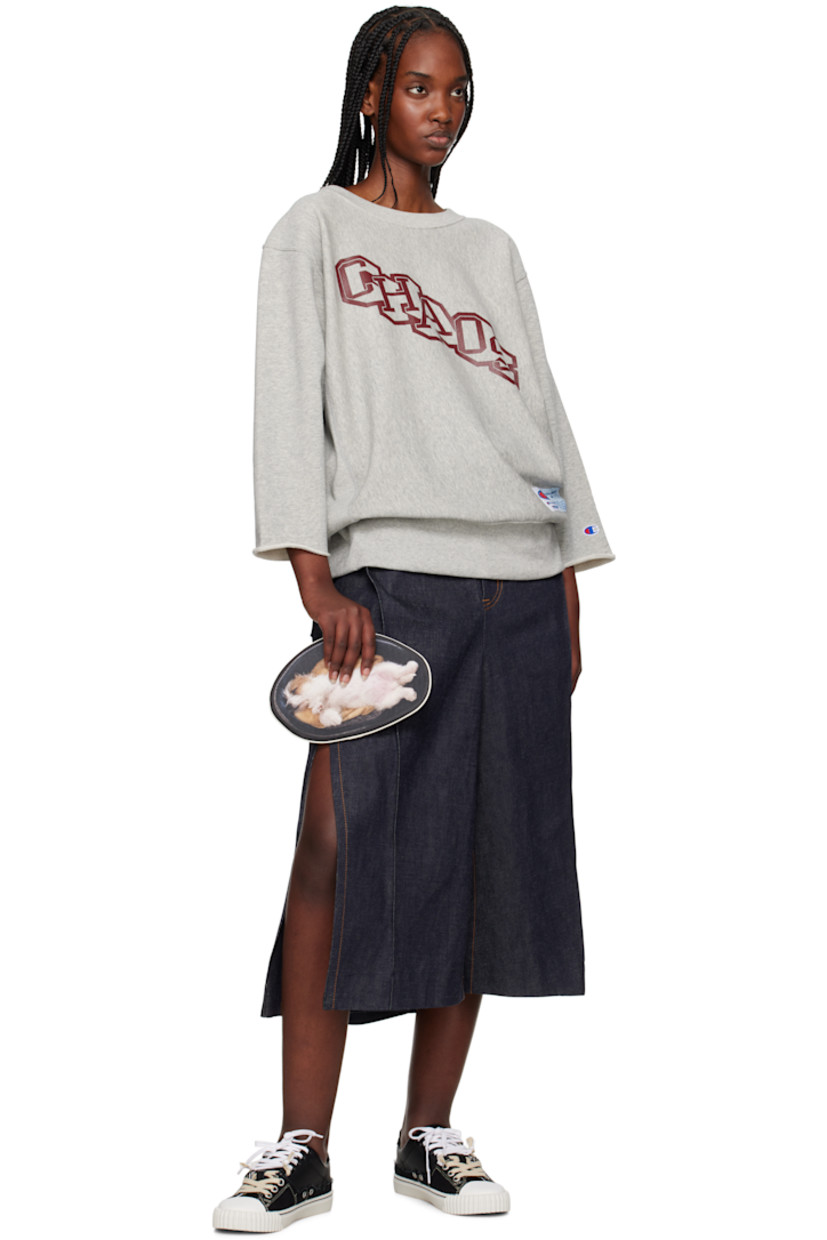 French terry sweatshirt.

· Rib-knit crewneck and hem 
· Text printed at front
· Logo patch at hem 
· Dropped shoulders
· Embroidered logo patch at cuff
· Rolled edge at cuffs

Part of the UNDERCOVER x Champion collaboration.

Supplier color: Top gray