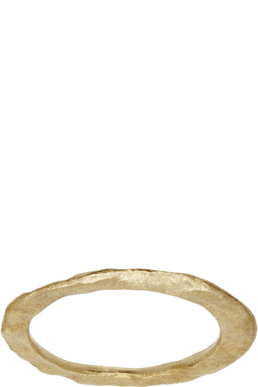 Band ring in antiqued gold-tone brass. Textured detailing throughout.

Part of the UNDERCOVER x noguchi collaboration.

Supplier color: Gold